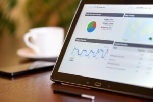 Tracking SEO performance metrics on a laptop dashboard for a real estate business in Singapore