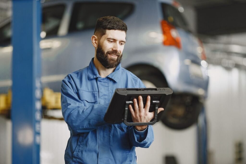 A business owner reviewing their website analytics on a laptop for seo for automotive singapore