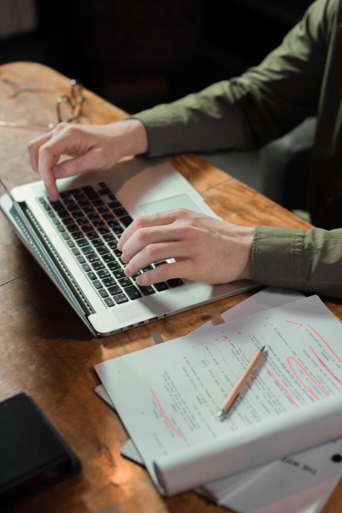 A writer drafting an seo article on a laptop for seo content automotive singapore