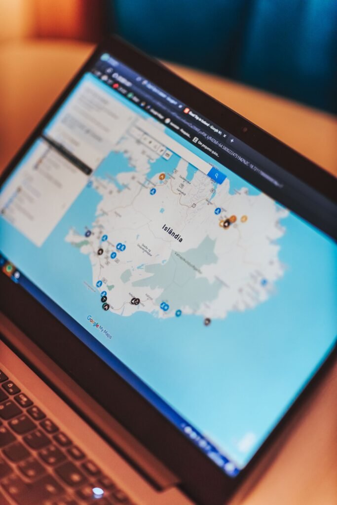 Salon owner marking neighbourhood locations for local seo beauty wellness singapore next to a laptop directory dashboard