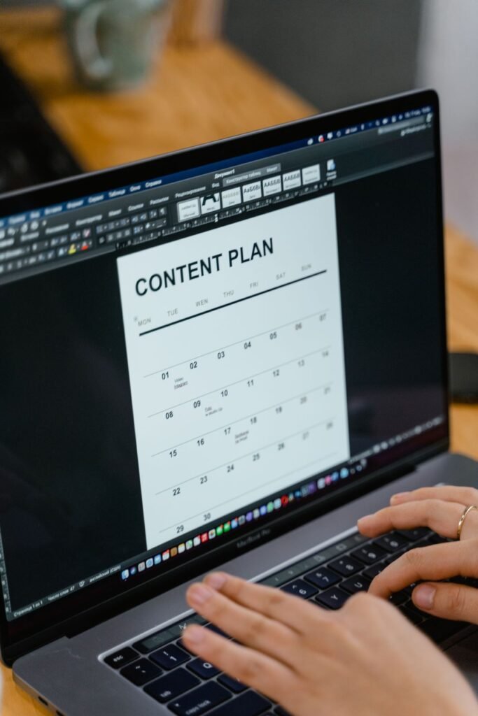 Content calendar and topic cluster map spread across a desk for seo content strategy school singapore
