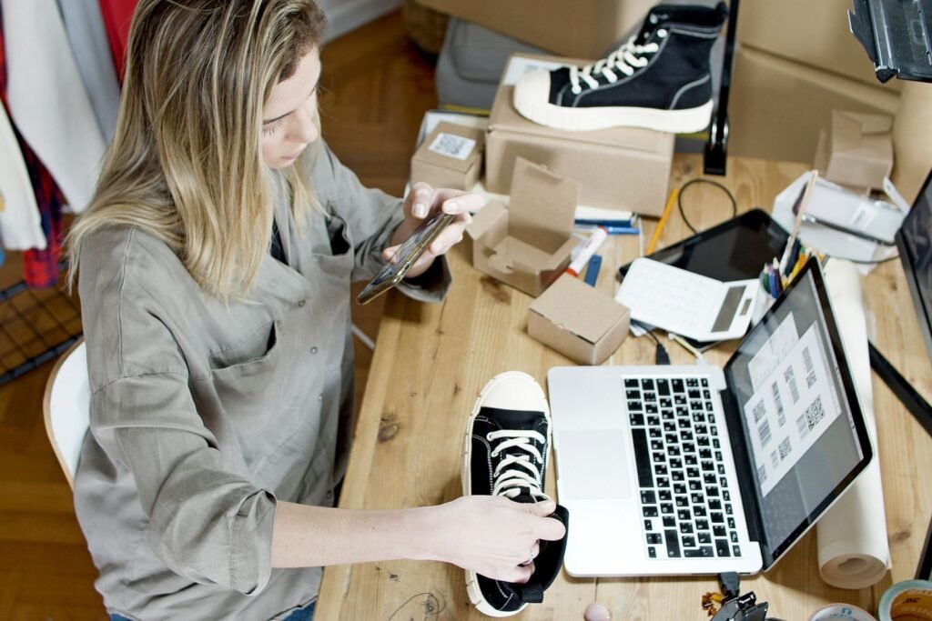 Singapore retail shop owner reviewing seo for retail singapore performance on a laptop