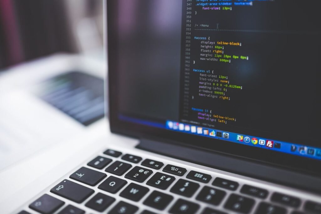 Laptop showing website code representing technical seo construction singapore fixes