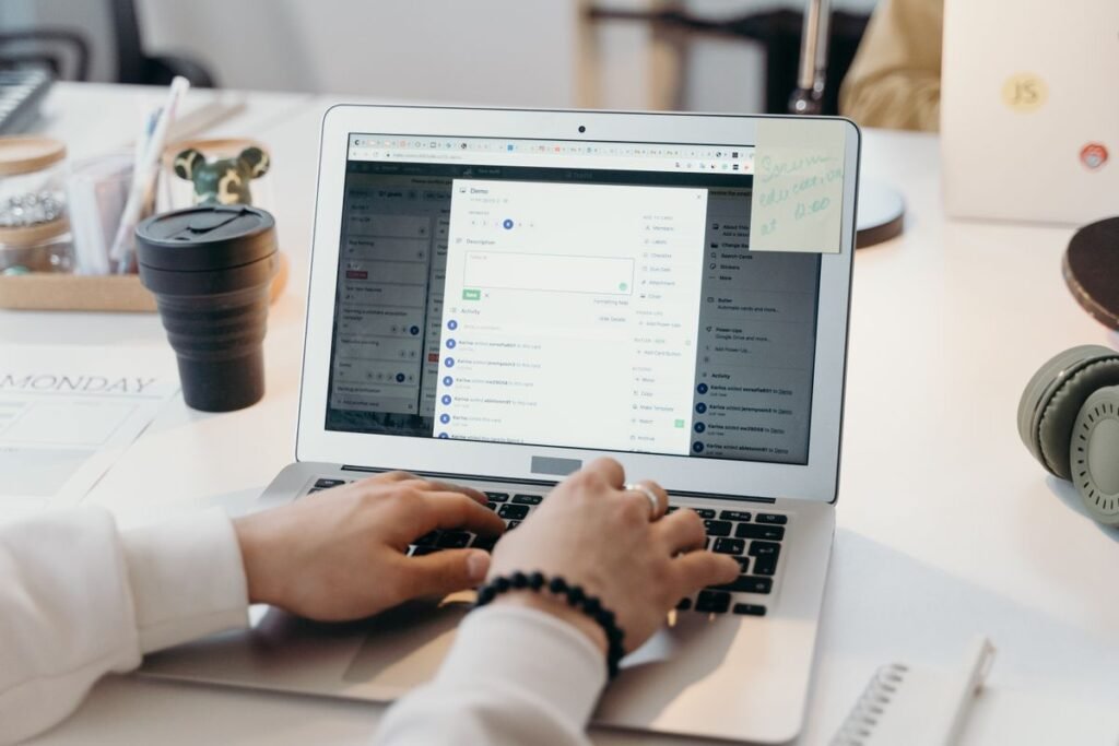 A marketer drafting an outreach email at a laptop, illustrating how to create backlinks