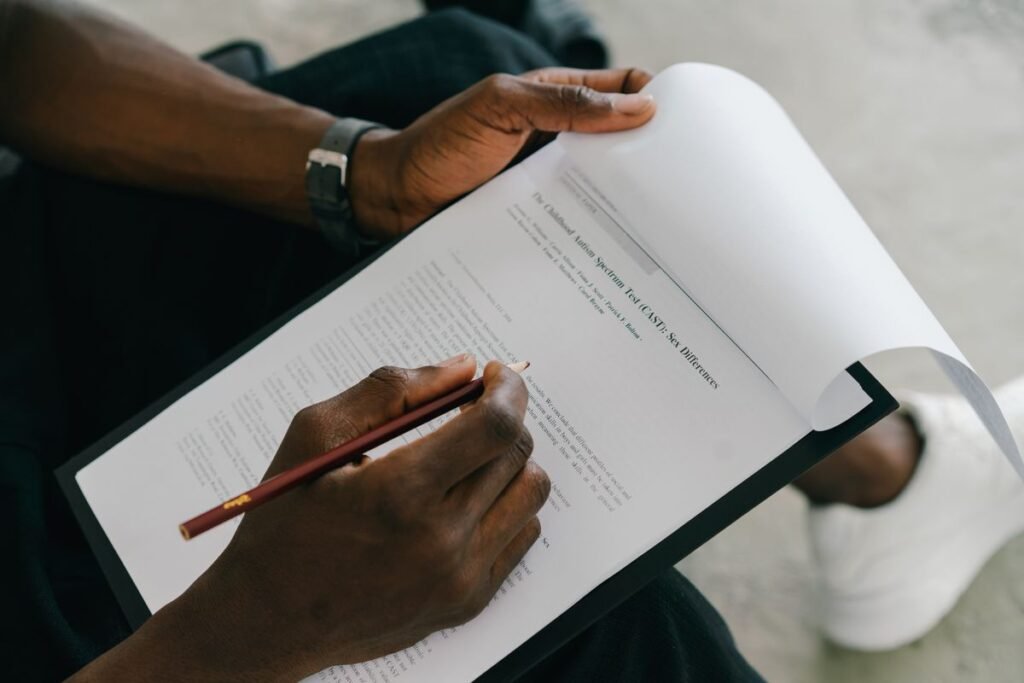 A printed scope document being reviewed before appointing a guest post service
