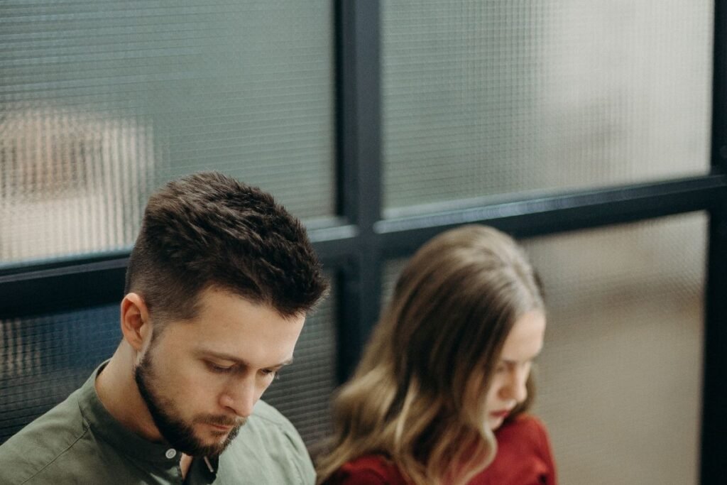 Two professionals reviewing a published article together, illustrating what is guest posting