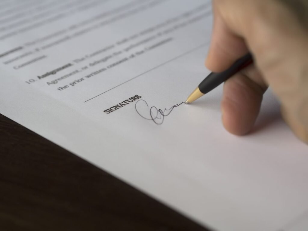 A contract signature page of the kind to review before appointing a link building agency