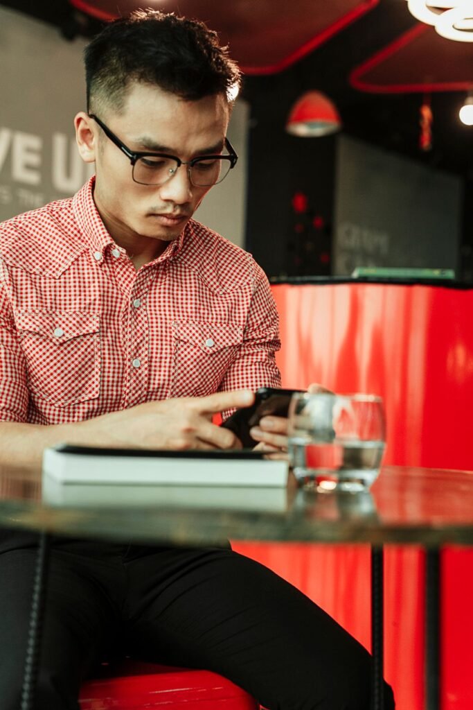Mobile speed optimisation Singapore business owner testing a website on a phone at an MRT station