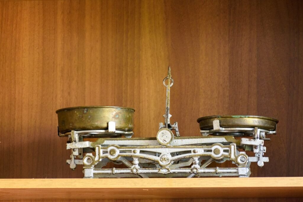 Balance scale weighing off page seo and on page seo signals for a Singapore website