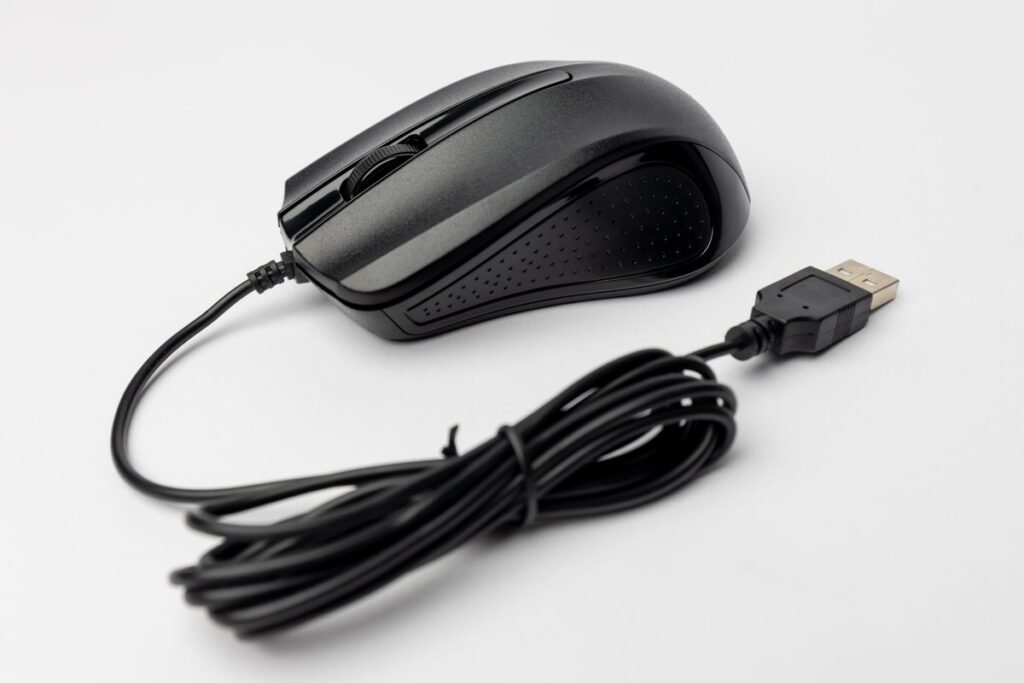 Computer mouse on a white surface, representing the click behind click through rate meaning
