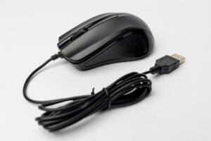 Computer mouse on a white surface, representing the click behind click through rate meaning
