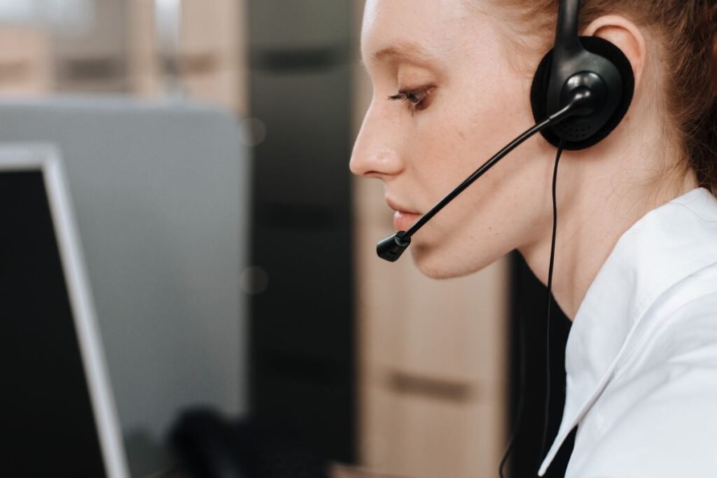 Call centre agent wearing a headset, representing direct marketing insurance services and consented outreach
