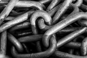 Close-up of steel chain links, representing backlinks found with the neil patel backlink checker