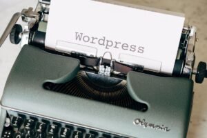 Typewriter with a page reading WordPress, representing Yoast SEO setup on a WordPress site